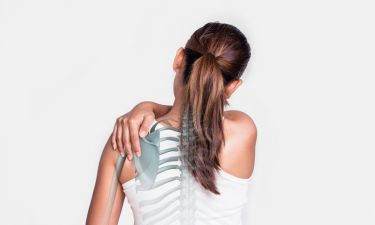 Asian woman with shoulder pain and see the bone.